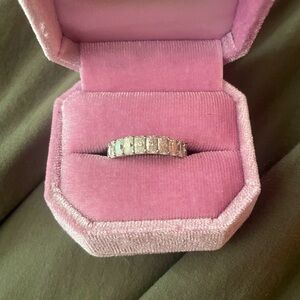 Lovely moissanite and 14k white gold radiant eternity band. Size 8.